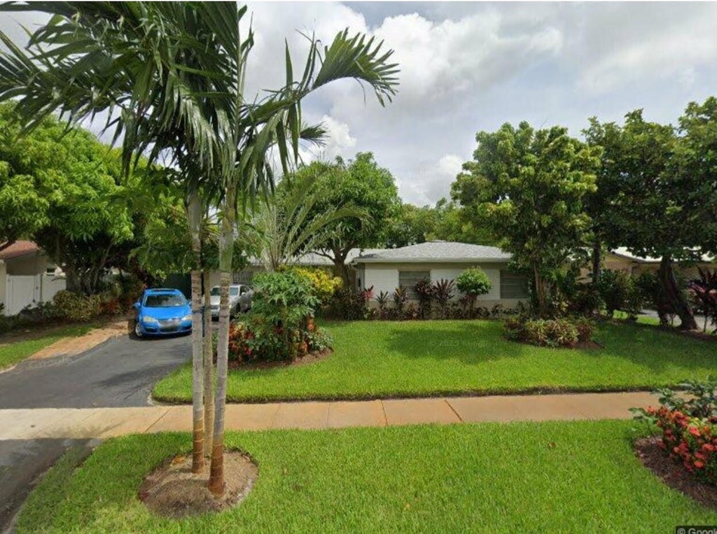 Photo of 4441 NW 13TH Street, Lauderhill, FL 33313 (MLS # B26077662)