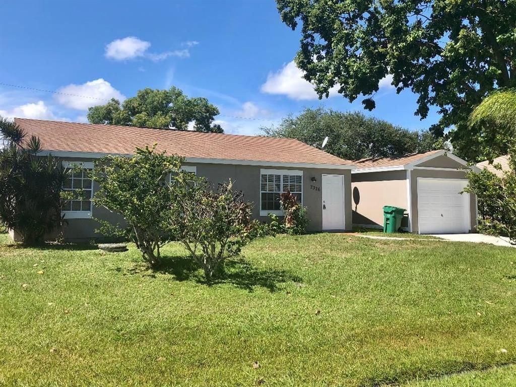 Photo of 2326 SE Merrill Road, Port Saint Lucie, FL 34952 (MLS # R10748987)