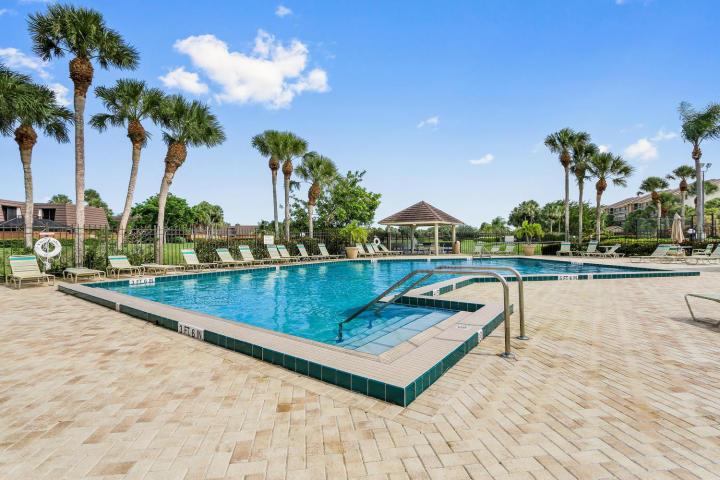 Available Season 2022! Lake view in The Bluffs. Beautiful updated townhouse in Lakes At The Bluffs. This unit is towards the front of the community and the master bedroom overlooks the lake. Tile floors, wood cabinets, granite countertops, and remodeled bathrooms. You can grill out on the patio and pets are ok. A 5 minute walk to the beach, Publix, restaurants, shops and more. 3 Month Minimum.