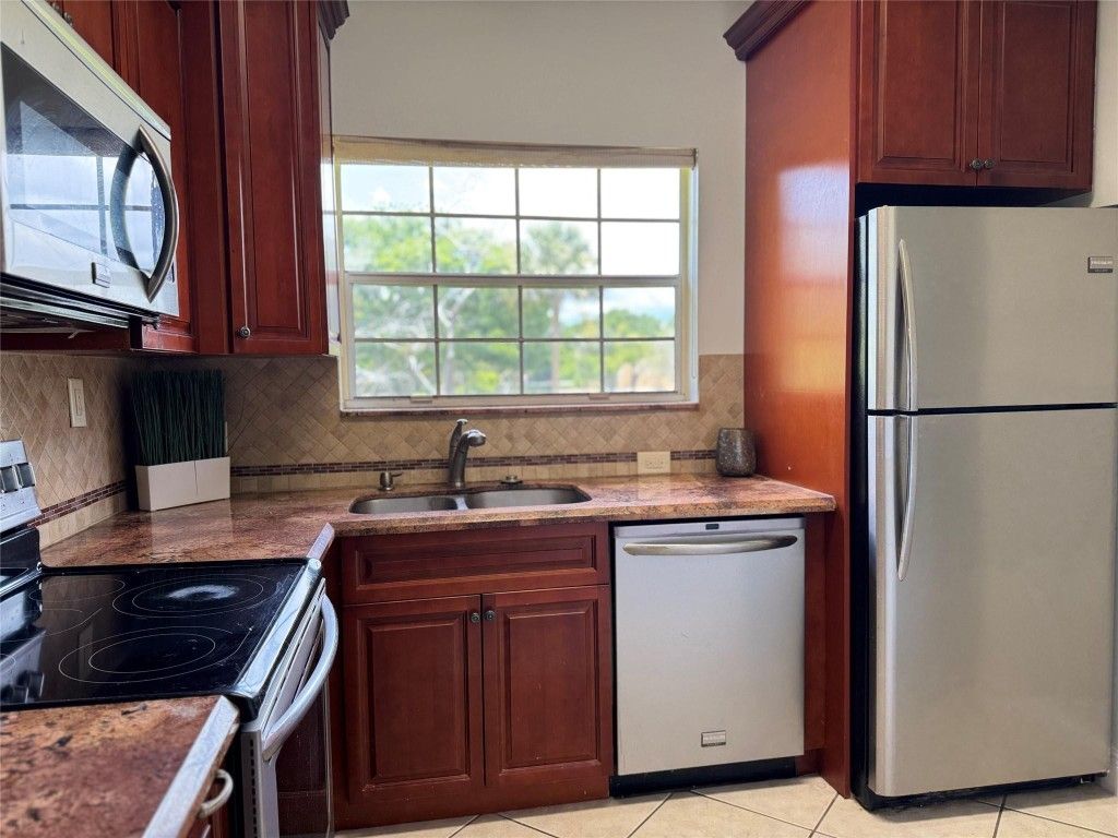 Photo of 800 Cypress Park Way #O, Pompano Beach, FL 33064 (MLS # F10511319)