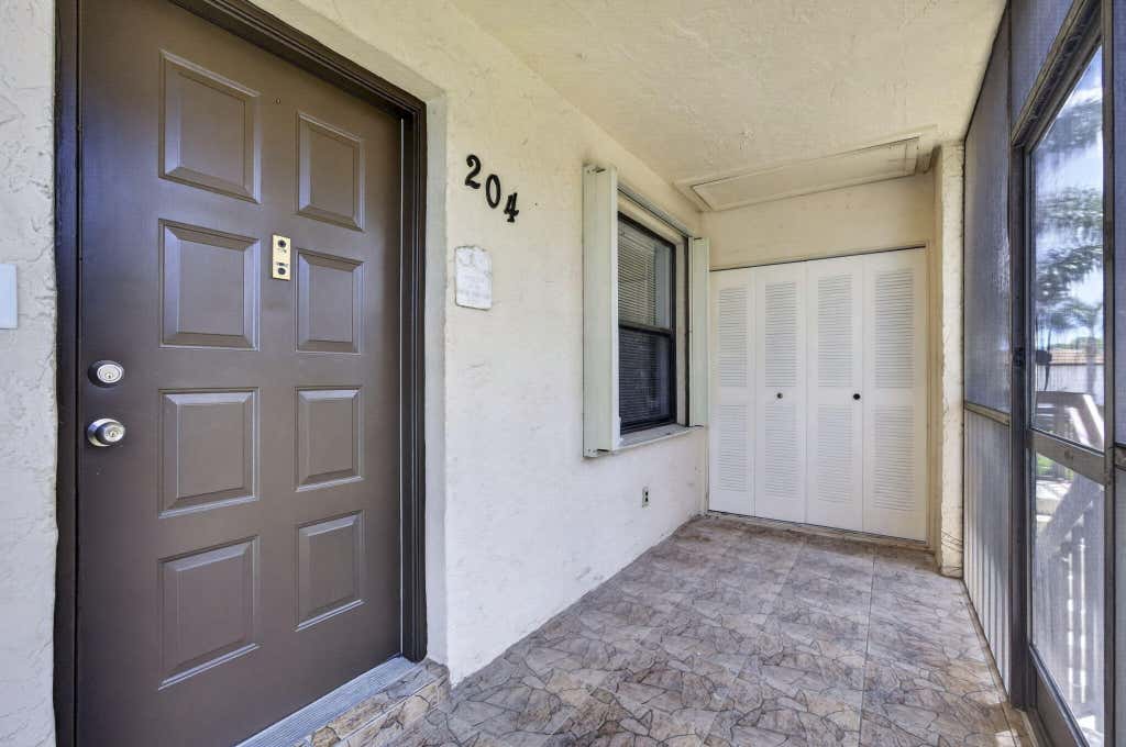 Photo of 7262 GOLF COLONY Court #204, Lake Worth, FL 33467 (MLS # B26063820)