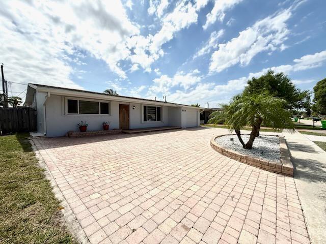 Beautiful 3BR/2BA home in a family-friendly Sunrise neighborhood! Features a spacious fenced lot, circular driveway, new bedroom floors, freshly painted interior/exterior, and large living/dining areas. Enjoy energy efficiency with solar panels (buyer must assume loan), hurricane accordion shutters, smart garage door w/ keypad, updated landscaping, and exterior lighting. Prime location near top restaurants, malls, and entertainment. Move-in ready—don’t miss this one!