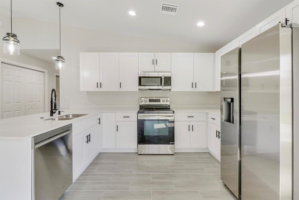 Photo of 2498 SW Bayshore Boulevard, Port Saint Lucie, FL 34984 (MLS # R10979899)