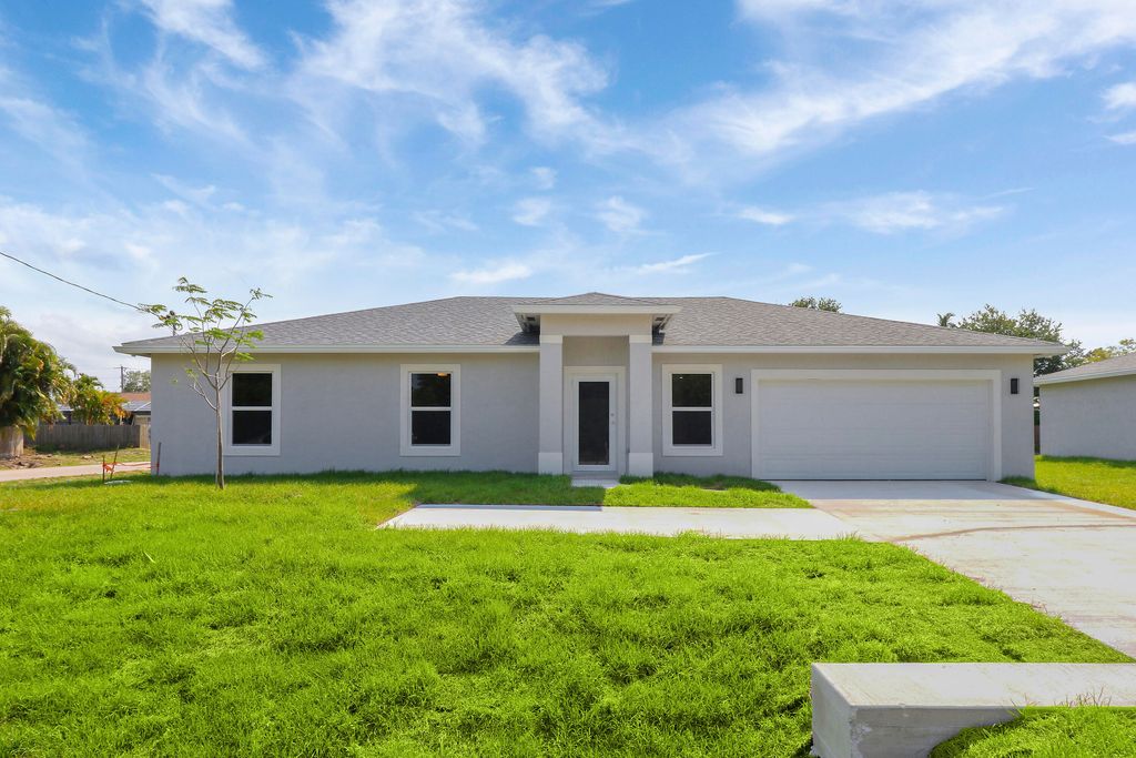 Photo of 2498 SW Bayshore Boulevard, Port Saint Lucie, FL 34984 (MLS # R10979899)