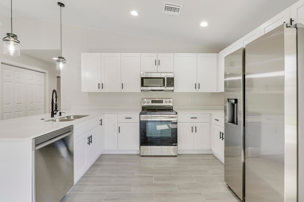 Photo of 2498 SW Bayshore Boulevard, Port Saint Lucie, FL 34984 (MLS # R10979899)