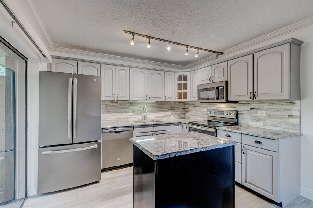 Photo of 1125 11th Lane, Palm Beach Gardens, FL 33418 (MLS # R10928147)