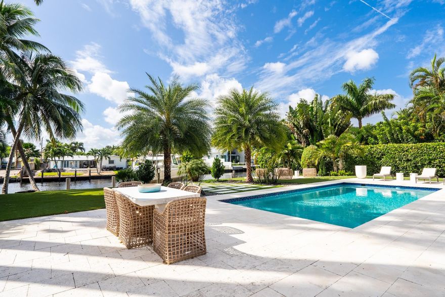 Gated Coral Ridge Waterfront home in Bayview school district in Fort Lauderdale. Luxury Designer finishes through out.  Great floor plan with 5 bedrooms plus office.  Oversized lot with 89ft on water. Impact windows & doors, natural gas, Generator, & more.  Extra wide waterway to Paddle board, water ski or kayak in your backyard.  Enjoy the most amazing sunsets. Best outdoor living in South Florida with large backyard and pool overlooking Middle River. Location, Location, Location.  Close to mall, beach, shops, dining, airport.  A must see.