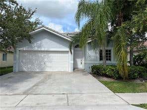 Photo of 7612 NW 99TH Terrace, Tamarac, FL 33321 (MLS # B26064063)