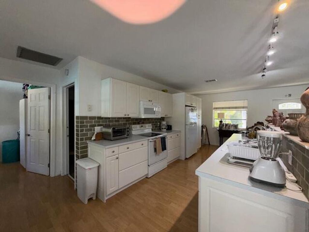 Photo of 394 Evergreen Avenue, Tequesta, FL 33469 (MLS # R11168760)