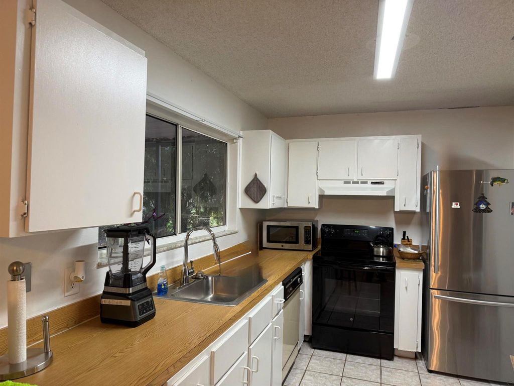 Photo of 2292 SE Berkshire Boulevard, Port Saint Lucie, FL 34952 (MLS # R11043548)