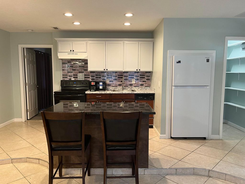 Photo of 491 SW Curtis Street, Port Saint Lucie, FL 34983 (MLS # B26010608)