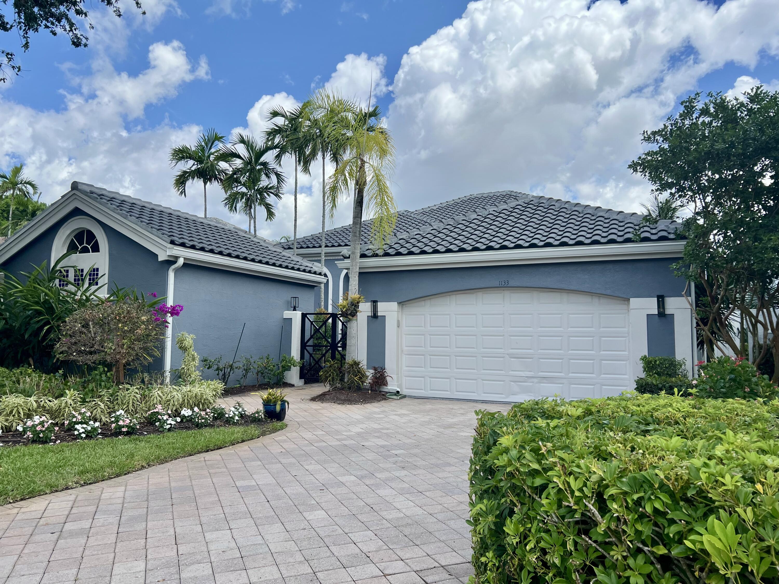 Experience luxury living at its finest in this stunning 4BD 4BA, 3,365 SF seasonal rental located in the prestigious Ballenisles Country Club community. Situated at 1133 Crystal Dr, Palm Beach Gardens FL, this exquisite property offers the perfect retreat for those seeking a high-end seasonal escape. The fabulous model features a breathtaking pool, private guest house, and picturesque views overlooking the fairway & lake. Located on a quiet cul-de-sac surrounded by the banyan-tree lined streets of Ballenisles, this home exudes tranquility and privacy. The property boasts numerous upgrades, including a new roof, granite kitchen, new carpet, crown molding, and more. The lush backyard is a tropical oasis, with mature and newer plants, including avocado trees, creating a serene outdoor space.