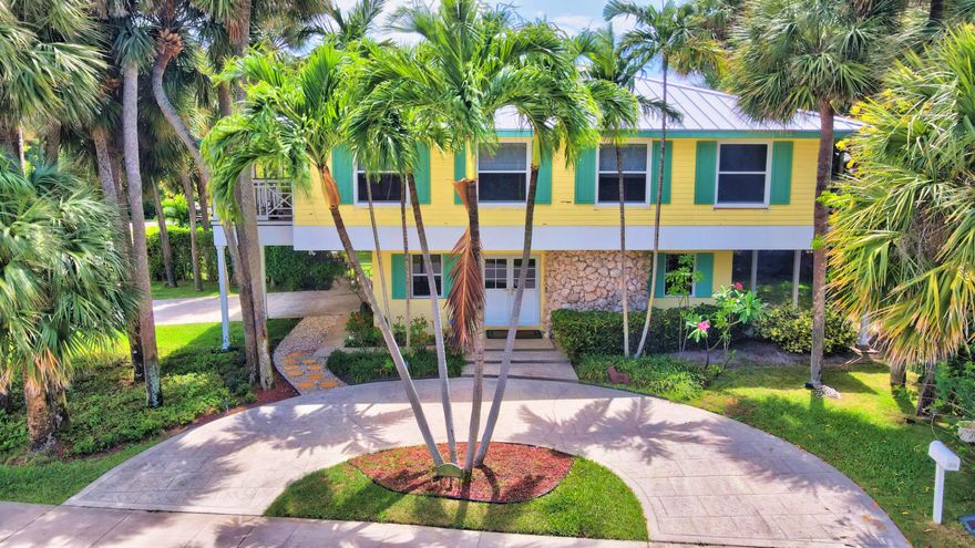 ONE OF A KIND-Fully updated and ready to move in Key West Style home in the highly sought after, boutique beachside neighborhood of Por La Mar.  This charming home is located on a double lot, and the possibilities are endless! Home was renovated in 2019 and includes an open floorplan with porcelain tile wood floors throughout. A gorgeous cook's kitchen with Bosch appliances, Island and large side-by-side refrigerator /freezer makes entertaining a breeze.   Main living area and 3 bedrooms are on the 2nd floor with full length balconies on the north and south sides.  Primary bedroom has a spa bath, with separate tub and shower.  Downstairs includes a full guest suite with bonus room for exercise, additional office, etc.    The side yard is a private oasis for this house, or can be separated developed as a full lot.  All windows and doors are impact, and the Metal roof was also replaced in 2019. The front of this house looks onto a private park which is the center of Por La Mar, with huge Ficus and Banyan trees.  Por La Mar is a Hidden enclave of luxury homes  only steps to the beach, the new Intracoastal waterfront park, and all the shops and restaurants of downtown Boca Raton.  There is nothing else like this so close to the beach.