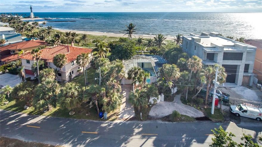 Beachfront! Charming and original 2/2 Florida Home in the prestigious Hillsboro Shores neighborhood. One of the few direct oceanfront properties in this small community located between Boca Raton and Ft Lauderdale.  The only thing between you and the ocean is the sand and dunes! Endless views, build your dream home here! Sold in "as-is" condition. Appt. only.