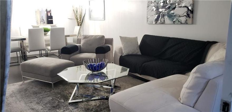 2 Bedroom’s 2 baths unit. Hardwood floors through all the unit.. updated kitchen with stainless steel appliances . Furniture is not included but it is negotiable. Dining chandelier is not included. Low HOA fees, can rent immediately.