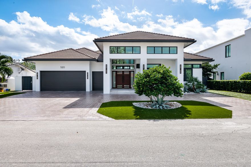 With desired southern exposure, this single-story home is located on a deep-water canal in the established neighborhood of Golden Harbour—walking distance to Mizner restaurants, Fifth Avenue shops and the best beaches in Boca Raton. This property is a boater's paradise with 85-feet of waterfront, including a 75-foot dock with 20,000-lbs elevator boat lift. 

Custom built and immaculately maintained, this residence features indoor and outdoor living at its best!  Designed to be maintenance free (by a yachting couple that spends months away from home), it includes Turf grass, 1-touch remote control hurricane screens, custom impact glass and doors, a summer kitchen, and private backyard. With a welcoming front porch, the foyer opens to a great room, bar and modern kitchen that seamlessly extends to an outdoor living room overlooking the waterway.  This residence includes 3 bedrooms, 3 full baths, 1 half bath. Total square footage: 4403 (2788 under air).



Architect: Miklos Architecture
Interior Design: BE Design
Builder: National Custom Homes  built in 2018


16ft ceilings in Entry, Foyer, Living Room and Covered Patio
11ft ceilings in Kitchen, Bedrooms, Bathrooms, Utility and Garage
4x4 imported Italian porcelain tile throughout common areas
2 Air Conditioners 
All Impact windows and doors by SIW
3-car garage, wired for electric vehicle charging 
Large circular driveway, sealed pavers
Turf grass
Outdoor Lighting system, with handcrafted Hubbardton Forge sconces
85ft Batter Pile and Capped seawall
Home automation powered by Samsung Smart Things platform
Custom Boat & Tackle room with outside shower

Great Room:
Custom architectural ceilings
Three architectural chandeliers
Built-in "floating" cabinetry by Neff
Built-in 75" Samsung TV 
Integrated Sonos sound system 
Display wall with architectural niches for artwork
Impact accordion doors that open to outdoor living room

Wet bar:
Bar counter area with custom cabinetry by Neff
U-Line ice maker
Stainless Sink
Display shelving with custom lighting


Kitchen:
Custom cabinetry by Neff 
Thermador 24" Column Freezer 
Thermador 24" Column Refrigerator
Miele Convection Oven and Microwave
Miele Combi Steam and Convection Oven
Miele Wine Refrigerator
Miele Dishwasher
Pompeii quartz countertops and waterfall edge
Custom glass backsplash 
Coffered ceilings with built-in lighting 
Ample cabinet storage
Built-in appliance garages
Rollout drawers within all floor to ceiling cabinetry
Breakfast area overlooking the water

Pantry Rooms: 
Large walk-in primary pantry 
LG Washer  front loading on pedestal 
LG Steam Dryer  front loading on pedestal
Prep/Utility sink 
Secondary walk-in pantry with buffet server 

Powder room:
Built-in cabinetry by Neff
Quartz countertop
Framed designed mirror with lighting
Custom decorative mural wall

Bedroom suite #1:
Modern ceiling fan
Custom window treatment, with remote control
Walk-in closet with custom shelving
Full length mirror
Private bathroom suite with custom cabinetry by Neff
Decorative wall sconces
Walk-in shower, floor-to-ceiling tile
Frameless glass door

Bedroom suite/office #2:
Modern ceiling fan
Custom window treatment, with remote control
Double-door closet with built-in cabinetry
Private bathroom suite with custom cabinetry by Neff 
Marble flooring
Decorative wall sconces
Walk-in shower, floor-to-ceiling tile
Frameless glass door

Master Suite: 
Private foyer
Windows overlook intracoastal
Custom blackout shades on remote, integrated in ceiling
Walk-in closet with custom shelving
2nd Walk-in closet with private entrance 

Master Bathroom:
Separate dual vanities, each with deep sink
Custom cabinetry by Neff
Floor-to-ceiling linen closet
Separate water closet
Massive walk-in marble shower with bench
Dual control shower heads plus a third handheld sprayer

Outdoor Kitchen
42" Windcrest Hood
32" Natural Gas Summerset Grill with separate 12" side burner
13" Stainless Steel Sink
Granite countertop
Custom cabinetry by Neff


Outdoor Dining Room:
Custom all-weather ceiling fan
Large entertaining space with room for a table that seats 10
Impact accordion doors that open to the kitchen
Fully enclosed by Category 5 Armor Screen (1-touch remote control) for hurricane protection

Outdoor Living Room:
Custom all-weather ceiling fan
Feature wall with floor-to-ceiling granite and lighting
Built-in gas fireplace, includes custom lighting features
Built-in 75" Samsung TV
Large entertaining space with room for furniture that seats 10
Fully enclosed by Category 5 Armor Screen (1-touch remote control) for hurricane protection

Dock Space:
10' x 75' custom designed dock with marine composite TanDeck boards
Neptune 20,000 Direct Drive Aluminum Elevator Boat Lift with upgrade to G3 High Speed
Shore power pedestal with 50 amp, 30 amp and 120v outlets
West side of house has unobstructed access to dock/yacht from street - 10ft wide gate with specialized turf embedded with concrete to allow for trucks, boat trailers, dockside refueling
Outdoor shower

Not included in sale price:  Intrepid 323 Cuddy Center Console Boat; 15ft Boston Whaler; Jet Dock