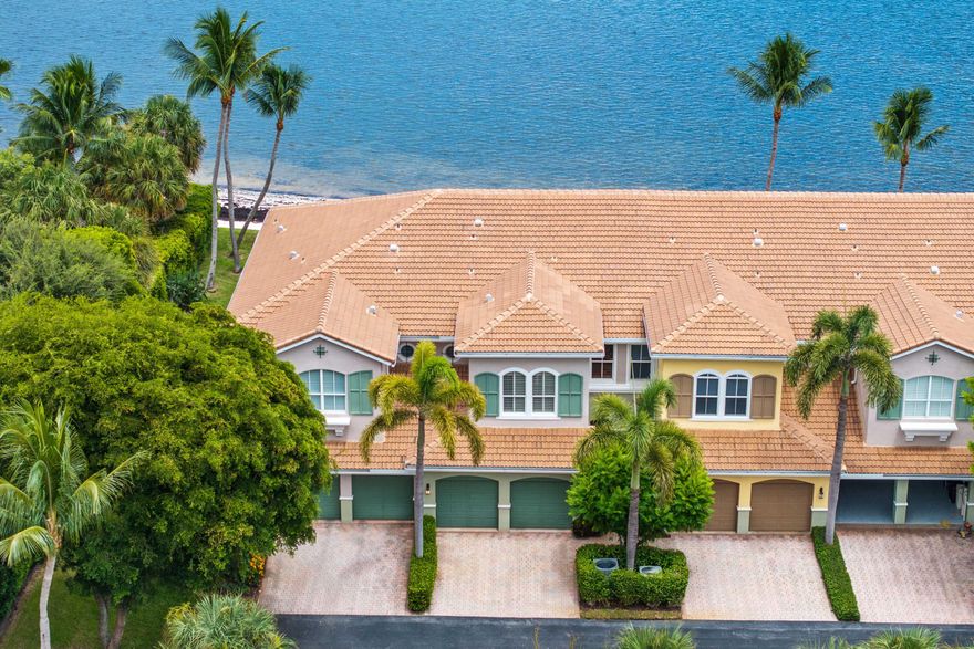 PRICED $200K BELOW APPRAISED VALUE! Welcome home to this RARELY AVAILABLE private beachfront townhome perched directly on the sandy shores of the Intracoastal--perfect for enjoying South Florida's indoor/outdoor lifestyle. This beautifully remodeled two story townhouse boasts three bedrooms plus large den, two and one half baths, and an oversized two car garage. As soon as you walk in the light-filled home, you are struck by the stunning Intracoastal views. The first floor's open layout includes high ceilings, a large den, powder room, dining room, open eat-in kitchen, and spacious living room. The living room and kitchen sliders open onto your backyard oasis including a covered patio with a hurricane proof, electronically retracting screen, a spacious open terrace, ample green space,  and your own private Intracoastal beach. Enjoy your coffee while watching the sunrise over the water or wind down with a cocktail at the end of the day while taking in the spectacular wide water views. The gorgeous, open, eat-in kitchen boasts granite countertops, custom wood cabinetry and pantry, and stainless steel appliances including newer refrigerator and dishwasher. Whole house upgrades include a NEW ROOF, impact glass throughout, a new AC, and wood flooring on the stairs. The expansive primary suite boasts Intracoastal views, vaulted ceilings, a large sitting area, and massive walk-in closet. The primary bath has been beautifully remodeled and includes new vanities and glass shower with chic tiling. The oversized secondary bedrooms are located away from the master to provide more privacy and boast high ceilings and large closets. The laundry room is conveniently located upstairs and includes a sink. Las Brisas is a highly-coveted, pet friendly, gated Intracoastal community just minutes to Palm Beach, Downtown Delray, Boca, and the beach. Enjoy the waterfront lifestyle from the heated saltwater pool or private beach just feet from your home. Watch the boats go by or join the action with your kayak or SUP--this is Florida living at its best! Make sure to check out the video tour of the home in the listing!