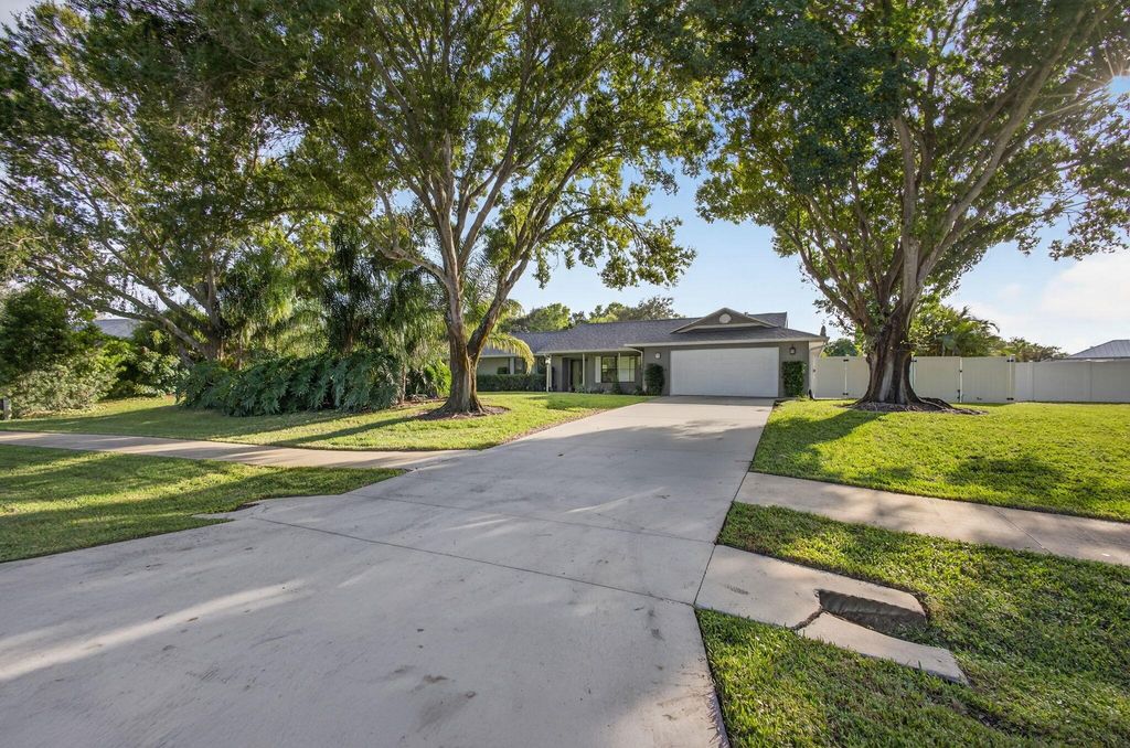 Photo of 2530 NE Pinecrest Lakes Boulevard, Jensen Beach, FL 34957 (MLS # R11139230)