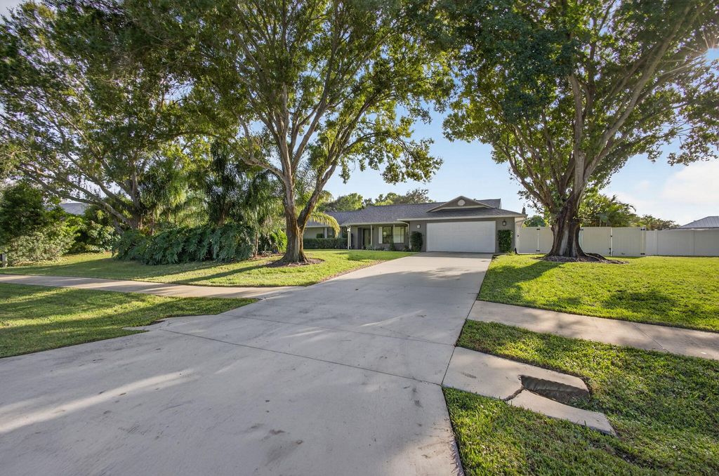 Photo of 2530 NE Pinecrest Lakes Boulevard, Jensen Beach, FL 34957 (MLS # R11139230)