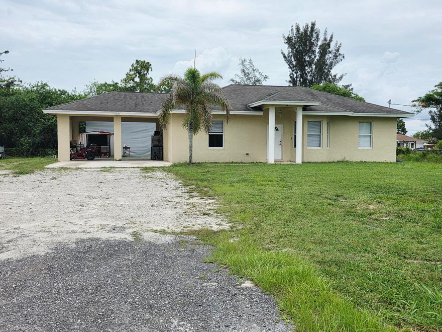 Bring your boats, RVs, toys, equipment, or business needs—this exceptional property has the space to accommodate it all. Immaculate 3-bedroom, 2-bathroom home situated on more than one acre, offering privacy, comfort, and endless possibilities. This well-maintained property showcases pride of ownership throughout and is ready for its next owner. The home also features a newly installed water filtration system, providing added value and peace of mind. The true highlight of this property is the impressive 40' x 60' permitted building, complete with paved access and ample space for RVs, boats, recreational vehicles, equipment, hobbies, storage, or a workshop. Whether you're a boating enthusiast, business owner, collector, or simply need extra space, this versatile structure provides excepti