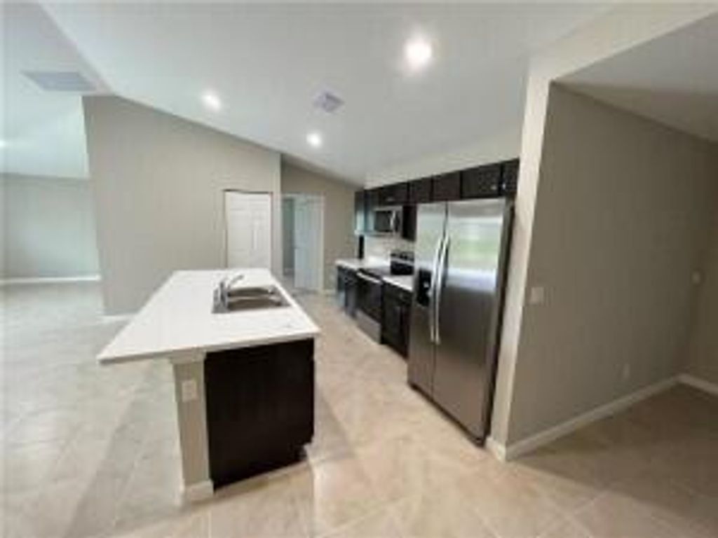 Photo of 561 SW Duxbury Avenue, Port Saint Lucie, FL 34983 (MLS # R11075316)