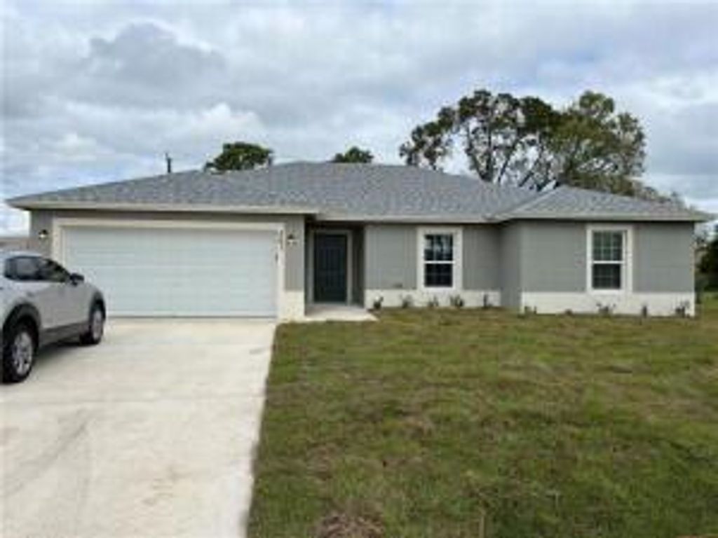 Photo of 561 SW Duxbury Avenue, Port Saint Lucie, FL 34983 (MLS # R11075316)