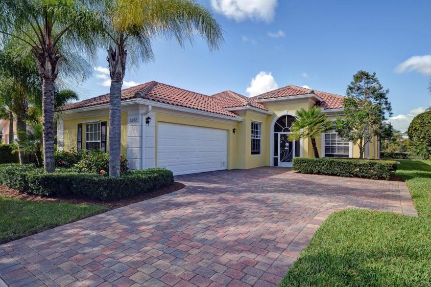 Florida living at its Best! Original Owner offering this Beautiful and Meticulously Maintained Lake front 3 bedroom + Den Oakmont Model Home with extended 1,120 sqft Screened Lanai Perfect for Entertaining in much sought after Lakes at Tradition. Built w/poured concrete construction along w/a respected Divosta Reputation. Located on a quiet cul-de-sac Street Full Maytag Stainless Steel appliance Package New Range/micro 9/2015, Dishwasher 5/2014, refrigerator 11/2012, Pullouts in pantry, All New hardware & Designer faucet, Lennox 16 SEER 3 Ton A/C compressor and Condenser w/12.5kw heat strip 7/2013 under warranty- 2023. His & Hers baths in Master Suite, Upgraded Berber Carpeting,Custom Shelving, 12' Ceilings living- 10' throughout, Built in Central Vac System, Exterior of home Painted 2014 Florida living at its Best! Original Owner offering this Beautiful & Meticulously Maintained 3 bdrm + Den Oakmont Model Home with extended 1,120 sq ft screened Lanai Perfect for entertaining in much sought after Lakes at Tradition. Built w/poured concrete construction along w/a respected Divosta Reputation. Located on a quiet cul-de-sac-Street. Kitchen boasts Full Maytag Stainless Steel appliance Package, New Range/microwave 9/2015, Dishwasher 5/2014, refrigerator 11/2012, Pullouts in pantry, All New hardware & Designer faucet, 2 years new Lennox 16 SEER 3 Ton A/C compressor and Condenser w/12.5kw heat strip 7/2013. His & Hers baths in Master Suite, Custom shelving in Closets, Upgraded Berber Carpeting, Built in Central Vacuum System, Interior painted 1/2012. Additional features Include 2 triple sliders off living & dining areas & Double slider from Master Bedroom open to Lanai, all with beautiful views of the lake, 12 ft ceiling in living & 10 ft ceilings throughout, 8 ft doorways w/crown Moldings. New ceiling fans in every room including Kitchen, living room (w/ light kit), 2 new ceiling fans on patio with light kits-(turns on/off by wall switch 3/2015). Shower enclosure in 2nd bath, Laundry Room with Amana by Whirlpool Washer/Dryer- 2012, Cabinets & Utility Sink. Garden recently mulched. 

High speed 25 MB Internet is included in HOA Fee with 5 Ethernet port outlets in 3 bedrooms, living room and kitchen- no modem needed. 
HOA Fee also includes Basic Cable, whole house Security alarm System/Monitoring, All Lawn Maintenance Including Trees, Shrubs, Fertilizer, Pressure washing of Sidewalks etc & Exterior painting. Resort Style Amenities including a 24 hour Manned Guard Gate, Clubhouse with Billiard and Ping pong, Game/card room, Playground, Picnic area, 2 pools- Geo-thermal heated Resort Style pool and heated lap pool, Full Gym/Fitness center, Tennis Courts, Basketball Court and Play Ground.

The lakes at Tradition is surrounded by sidewalks throughout with scenic lush landscaping and is with-in walking/biking distance to the Town Center of Tradition offering shopping, dining, professional services and more! Enjoy events in Tradition Square such as festivals, concerts, Holiday events and much more or just take pleasure in a leisurely walk along the broad sidewalks and tree-lined streets surrounding Tradition Lake