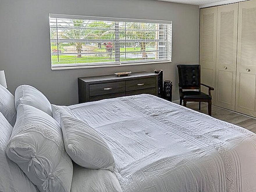 This beautiful 2/2 unit comes **fully furnished** and is **turnkey**, with only a few exceptions.   Located in a peaceful neighborhood in phase 6.  Kitchen is tastefully upgraded with a passthru window onto the dining room.  Nice laminate floors thruout living/dining/kitchen/& master bedroom.   Impeccable bathrooms, & the vanities were replaced and all the water pipes have been  changed! The electrical panel has been upgraded.   AC 2022, WH 2024 Secure pool and clubhouse area, offers billiards, exercise machines, heated pool, shuffleboard, and lots of activities!!  Step out from your patio to enjoy the grounds!  New roof and building 50 years have been completed.  Included in maintenance is insurance, pest control, and internet.  Come see for yourself!!  $70000 income & 55+ condo