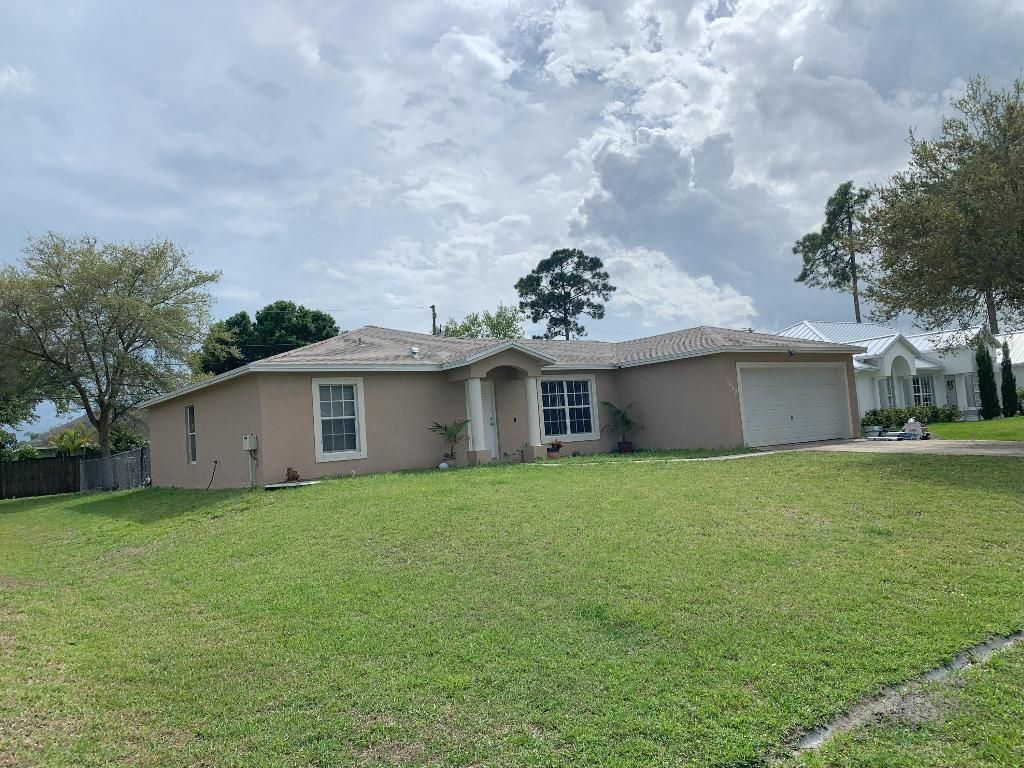 Photo of 1062 SW Macao Avenue, Port Saint Lucie, FL 34953 (MLS # R10995970)