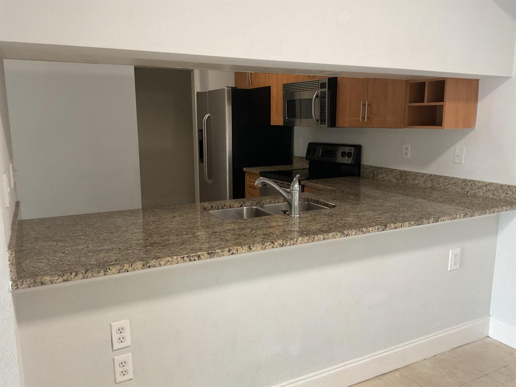 Photo of 6510 Emerald Dunes Drive #202, West Palm Beach, FL 33411 (MLS # R11092890)
