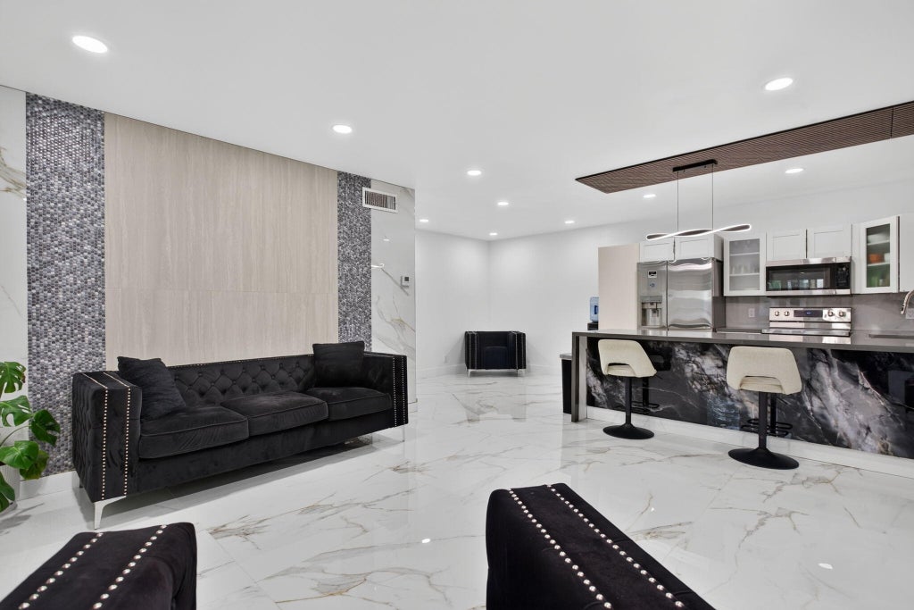 Photo of 8404 W SAMPLE Road #230, Coral Springs, FL 33065 (MLS # B26072838)