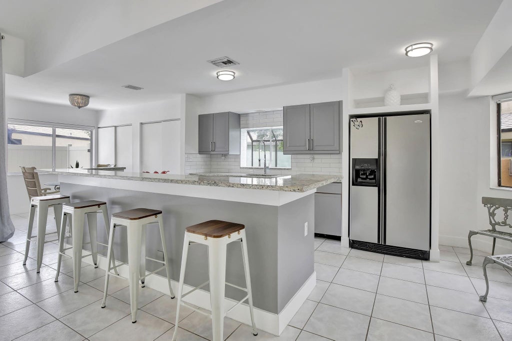 Photo of 9341 Chelsea Drive S, Plantation, FL 33324 (MLS # B26081333)