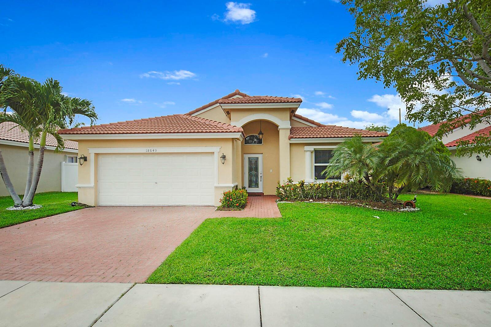 Step into comfort, style, and security in this beautifully maintained 3-bedroom, 2-bathroom single-family home, ideally situated in a sought-after gated community. With a desirable split-bedroom floor plan and soaring vaulted ceilings, this open-concept home is designed to feel spacious, airy, and inviting. Enjoy the benefits of new impact windows and a new roof, offering both peace of mind and modern curb appeal. The light-filled living areas flow effortlessly to a large private patio, perfect for entertaining or simply relaxing in your own serene retreat—with no rear neighbors for added privacy. This residence offers more than just a home—it delivers a lifestyle of elegance, ease, and exclusivity. Come experience refined living in this quiet, gated oasis.