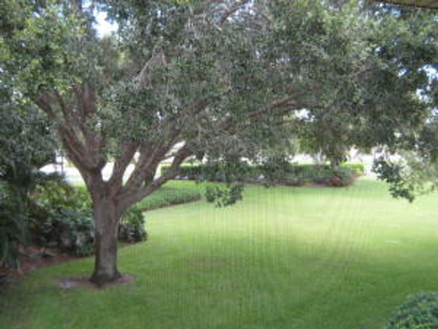 Immaculate...and easy to show 3Br/2Ba 2nd floor end unit with large terrace overlooking massive oak trees.  Unit features include: Brand new air conditioner, newer kitchen and dark wood laminate floors throughout. This unit is a great value! Located in one of Tequesta's finest golf communities. community offers clubhouse, exercise room, car wash and golf.