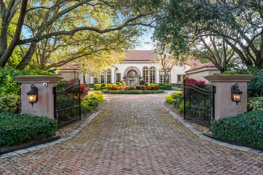This one-story classic ''Montecito Style'' residence is located on 2.13 acres of meticulously manicured grounds within Boca Raton's most prestigious & intimate gated enclave of only 32 multi-acre estates. Designed by award winning architect Randall Stofft, this exquisite lakefront estate seamlessly blends an indoor/outdoor vibe with traditional elements, warmth & cohesiveness & features a stunning lushly landscaped gated entry with circular driveway & stone fountain. This home offers 5 bedrooms, 6.1 bathrooms, office/library, media room/den, playroom & side-load air conditioned 4 car garage.  The luxurious & grand outdoor space is full of amenities & features designed for intimate family gatherings as well as elegant & sophisticated entertaining. Included is a large patio with multiple covered loggias, outdoor summer kitchen & entertainment area, fireplace, oversized pool & walking path leading to dock with electric pontoon boat. Other features include impact windows & doors & a full house generator. Le Lac features 70 acres of spectacular lakes allowing motor boats & water sports.
