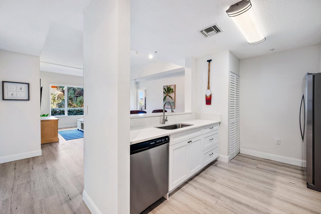 Photo of 1203 Town Center Drive #201, Jupiter, FL 33458 (MLS # B26092289)