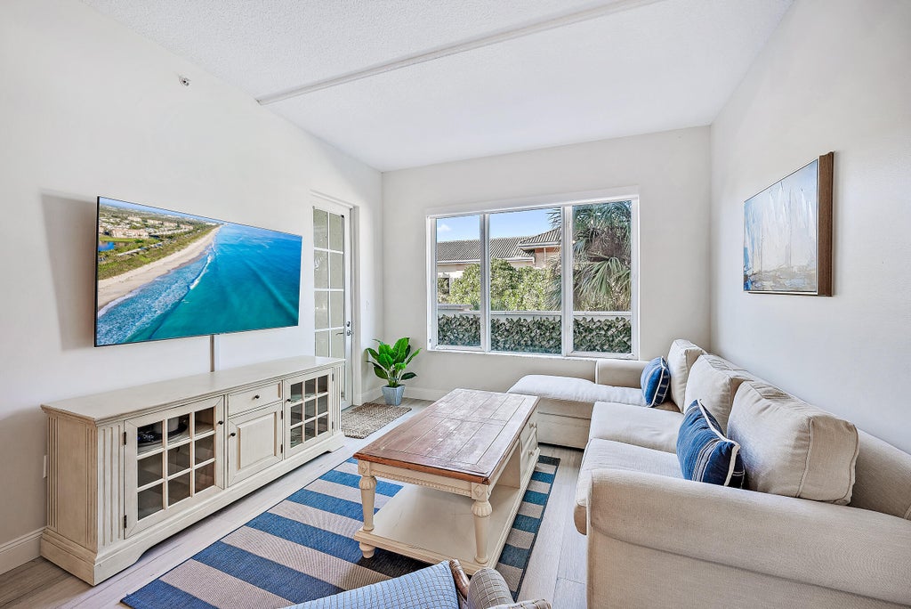 Photo of 1203 Town Center Drive #201, Jupiter, FL 33458 (MLS # B26092289)