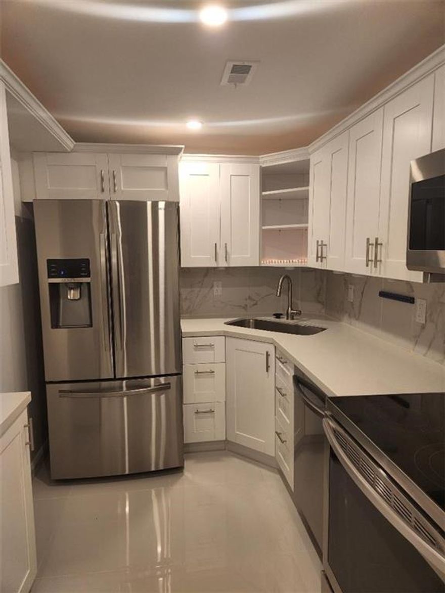 This is a statistical listing. Unit is Spotless, modern, bright, like new. White tile throughout. Kitchen and bath remodeled 2 yrs ago. New A/C, windows. Updated lighting. Tankless h20. A pleasure to be in.