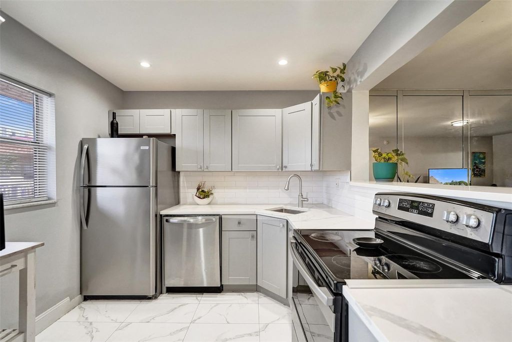 Photo of 608 SW Natura Boulevard #308, Deerfield Beach, FL 33441 (MLS # F10544347)