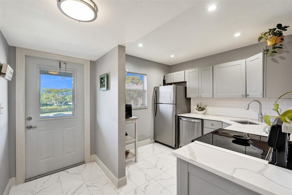 Photo of 608 SW Natura Boulevard #308, Deerfield Beach, FL 33441 (MLS # F10544347)