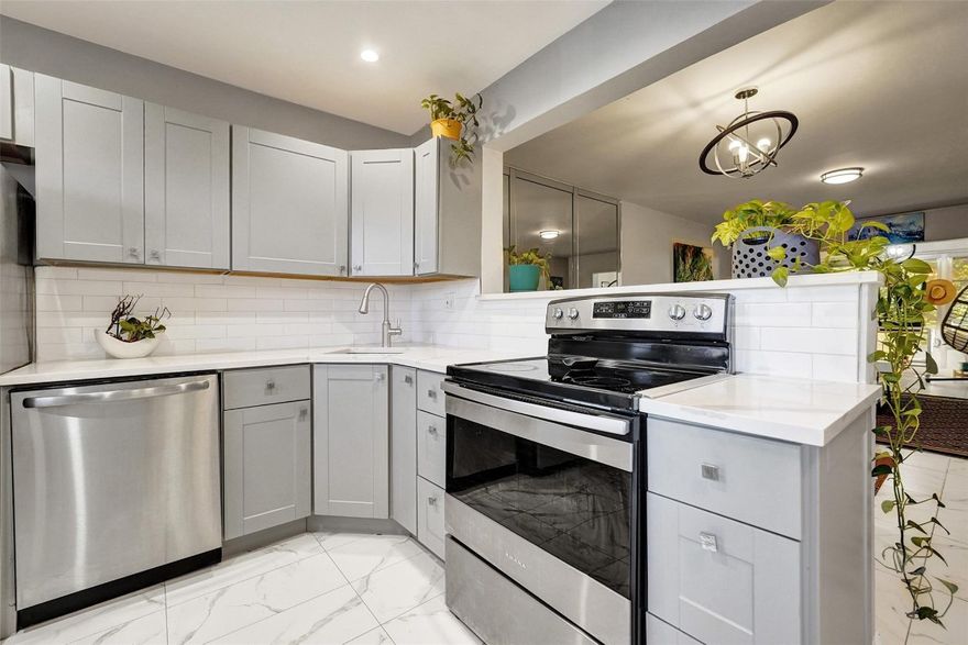 Beautifully updated 1BR/1.5BA condo in the desirable 55+ Natura Condo Community. Enjoy tranquil views of mature trees with the lake just beyond. This move-in ready residence features an open kitchen with updated cabinetry, counters, and backsplash, modern flooring throughout, and a spacious bedroom with walk-in closet and ensuite bath showcasing a marble shower. The updated guest half-bath adds convenience, while central A/C (approx. 4 years old) offers peace of mind. Bright, clean, and impeccably maintained. The community offers scenic lakes, walking and biking paths, a heated pool, and an active clubhouse with weekly activities. Building has passed 40 year inspection, new roof 2024 & elevator 2025. Ideally located minutes to Deerfield Beach, shopping, dining, and I-95.