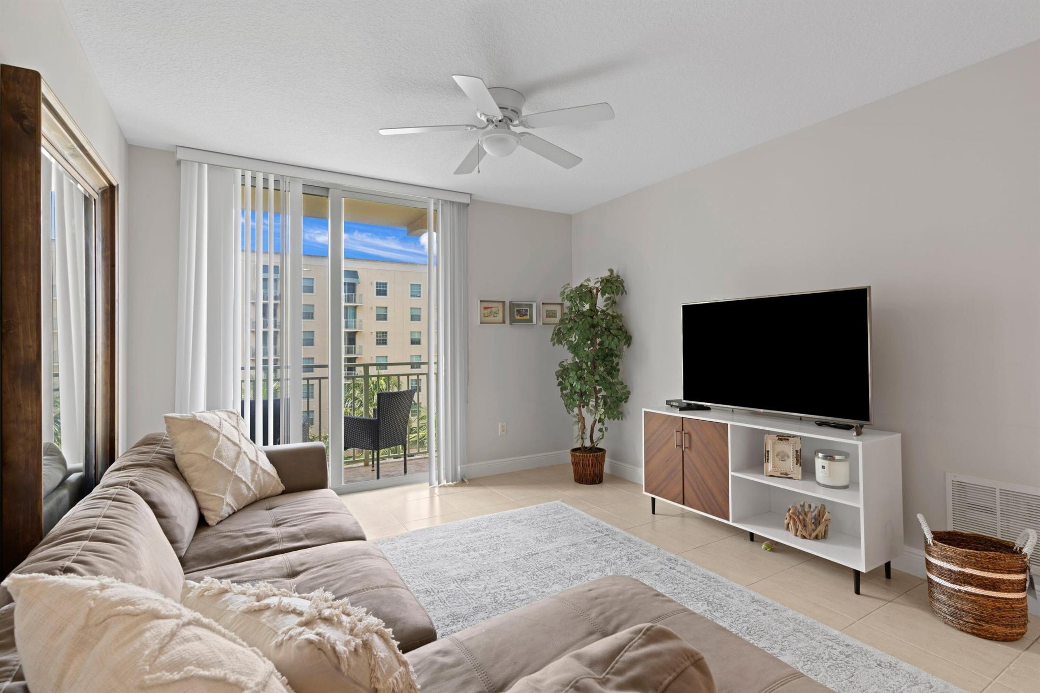 Spacious 2/2 condo in 610 Clematis with a relaxing view of the interior resort style pool & lush garden. Enjoy beautiful Florida sunsets from your quiet balcony. TWO PARKING SPACES included! Great location - walk to groceries, coffee shops, restaurants & entertainment as well as the intracoastal waters. Builder kitchen with granite countertops, European cabinetry and stainless steel appliances. The building offers 24 hour front desk security, garage parking, fitness center & sauna. Quick move in and pet friendly! The unit is receiving new carpet and new paint.