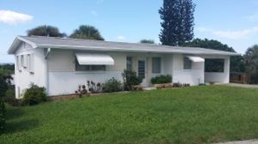 Unique three bedroom, two bath home with full basement and a one car carport. This home offers views of the Indian River from rear enclosed family room. Included in this sale is a second lot which can be sold separately and built upon or kept for additional privacy. Roof 2003, HVAC in/out 2013, water filter kitchen 2010, exterior painted 2003. Home is on well and septic, but owner to hook up city water prior to closing.