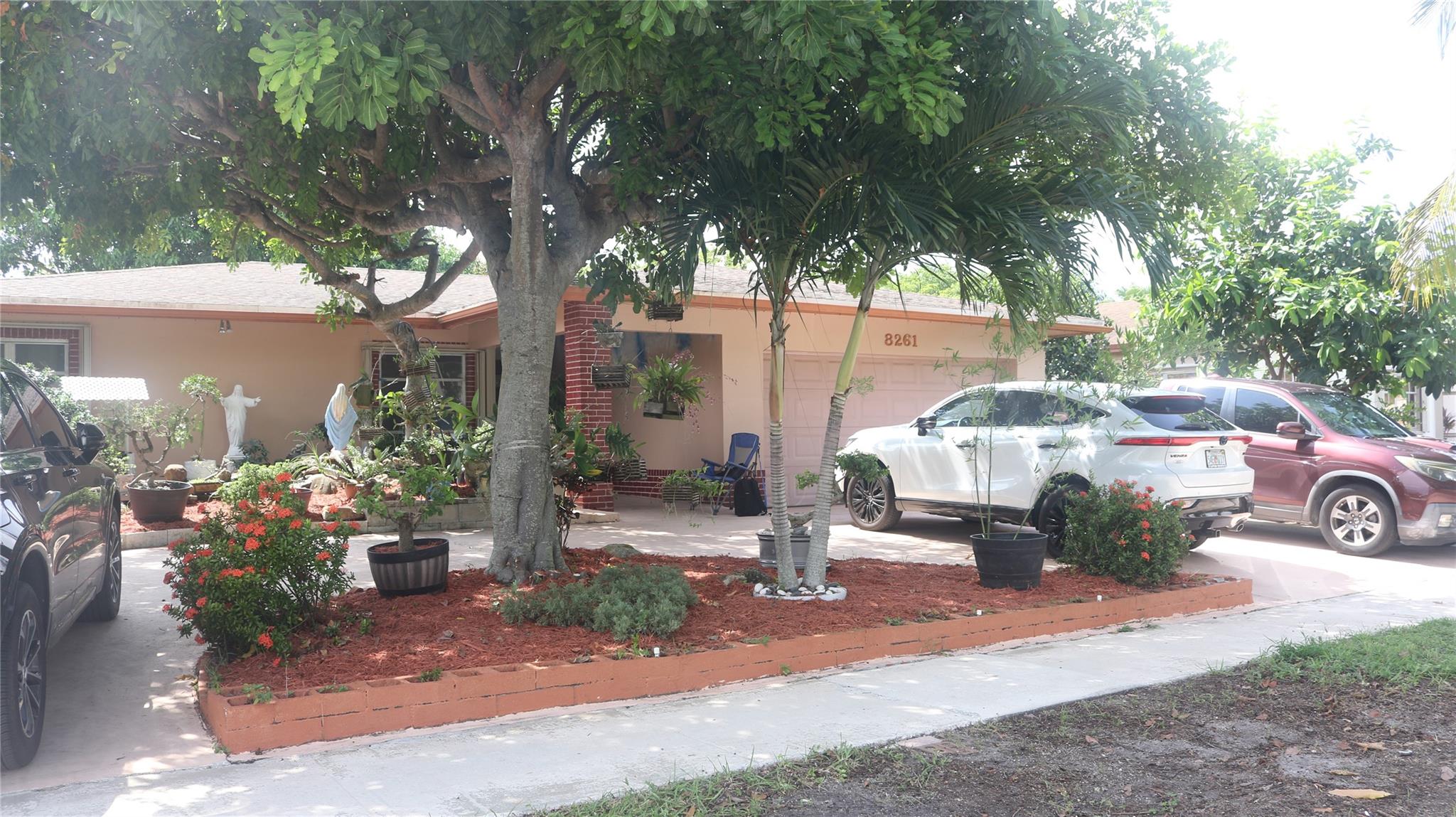 Welcome to this charming single family home in Tamarac, 4 bedrooms, 2 bathrooms with 2 car garage located in quiet neighborhood. Featuring a spacious layout, this property offers a bright living area, functional kitchen, and comfortable back yard. The home boasts a large circular driveway for easy parking and convenience. Enjoy the outdoors with a private backyard filled with fruit trees, creating a peaceful retreat right at home. Conveniently located near shopping, dinging, schools, and major hi ways. Don't miss the opportunity to make this home yours!