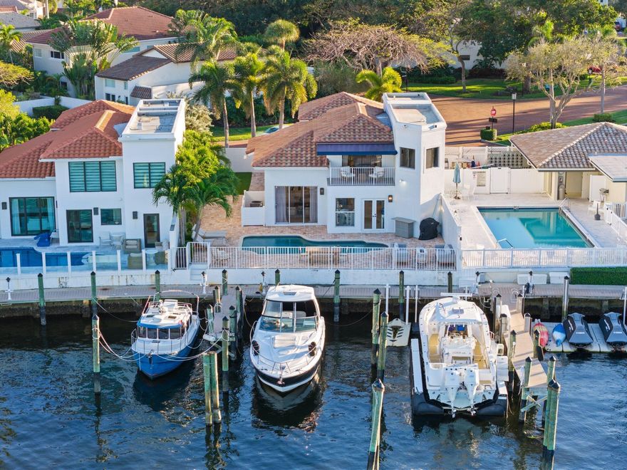 Welcome to 483 Pelican Way, a rare waterfront residence located within one of Delray Beach's exclusive gated Intracoastal communities - Pelican Harbor.  Perfectly positioned on a premier lot, this home features a private backyard pool with sweeping, panoramic water views that create a true sense of coastal serenity.  Your 60-foot, private, deeded dock is just steps from your backyard.  No fixed bridges and ocean access within a half hour in either direction make this a true boaters dream.  The light-filled interior offers an open, flowing floor plan designed to capture the water from nearly every room. Expansive living and dining spaces showcase soaring ceilings, impact glass doors, and seamless indoor-outdoor connectivity - ideal for both entertaining and everyday living. The primary suite is a private retreat, highlighted by a waterfront balcony, spa-inspired bath with dual vanities, and generous walk-in closets.  Pelican Harbor is an ideally located community - right between Delray and Boca Raton and just minutes from Atlantic Avenue and Mizner Park - that offers 24-hour gated manned security, pickleball, tennis, community pool, gym, community room, and more.