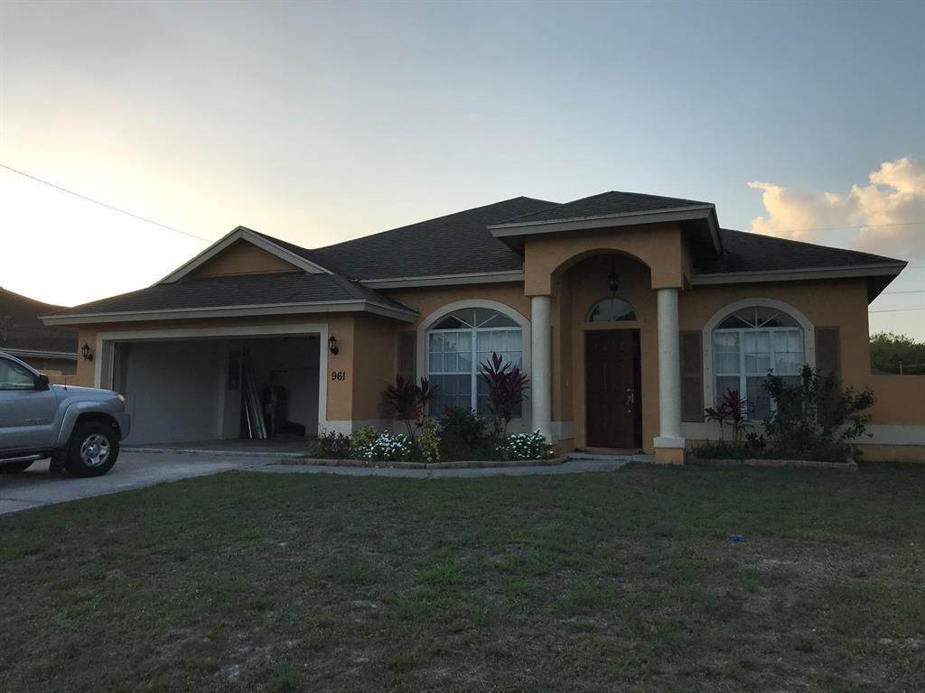 Photo of 961 SW Mcelroy Avenue, Port Saint Lucie, FL 34953 (MLS # R10712641)