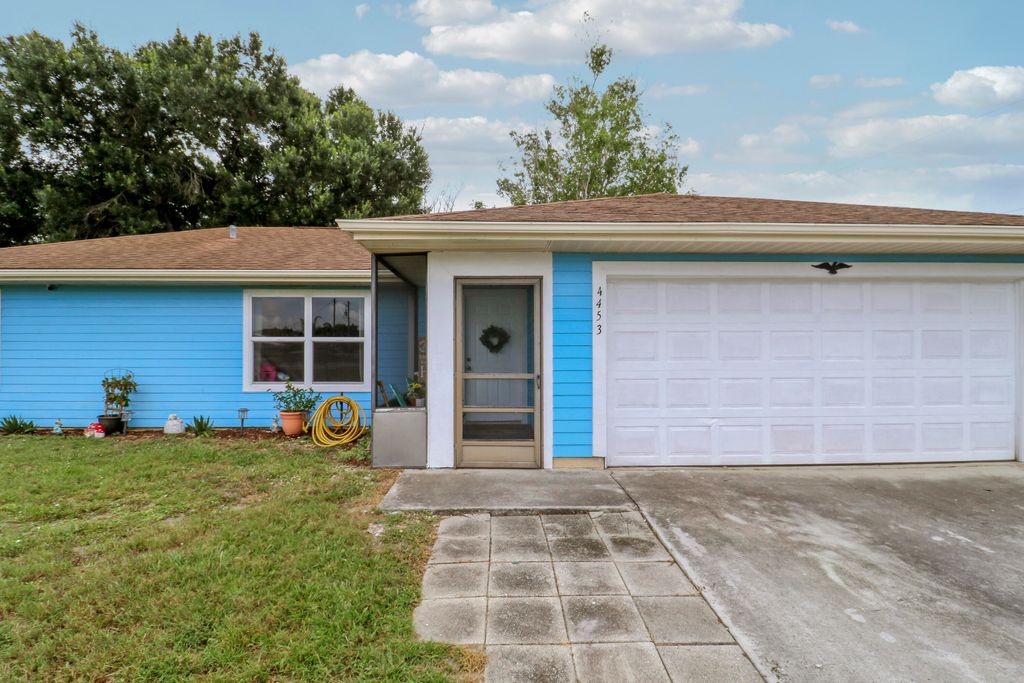 Photo of 4453 SW Bradbury Street, Port Saint Lucie, FL 34953 (MLS # B26039858)