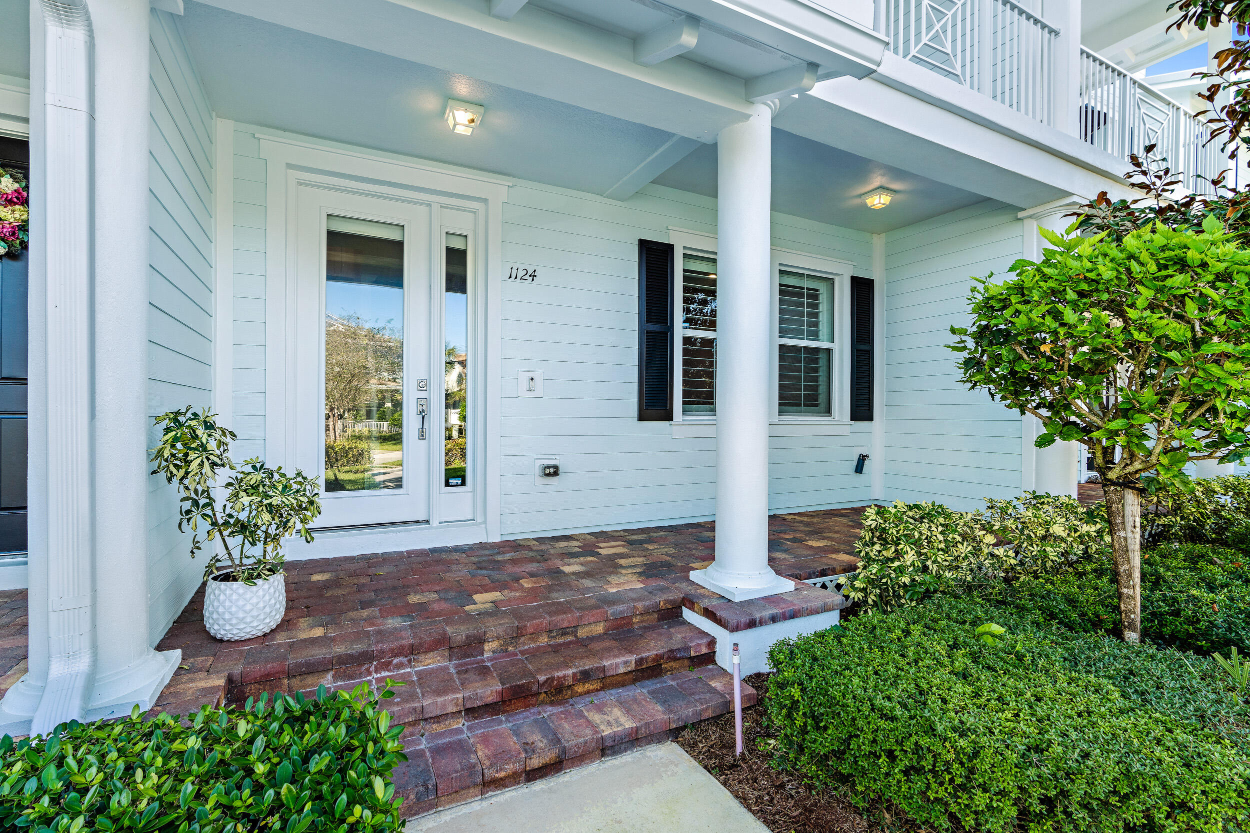 This lovely Key West Style townhouse has 3 beds, 2.5 baths, impact windows / doors throughout and CBS built in 2015 with a metal roof. Hardwood floors complete the downstairs living area, the kitchen has granite counter tops that are matching in the bathrooms, solid wood cabinetry, stainless appliances, and entry into the utility room with your laundry and half bath. The single car garage has a finished floor. The staircase and upstairs has newer carpet. There are 2 covered balconies and a covered patio up front. This property does have a very nice grassed front yard. There is a Simply Safe home alarm that can be re-activated. Abacoa is the host to several music events, arts, and sports events, along with shopping and restaurants to enjoy the neighborhood.
