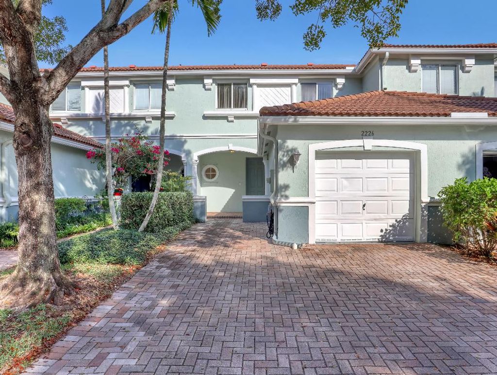 Photo of 2226 Oakmont Drive, Riviera Beach, FL 33404 (MLS # R11133088)