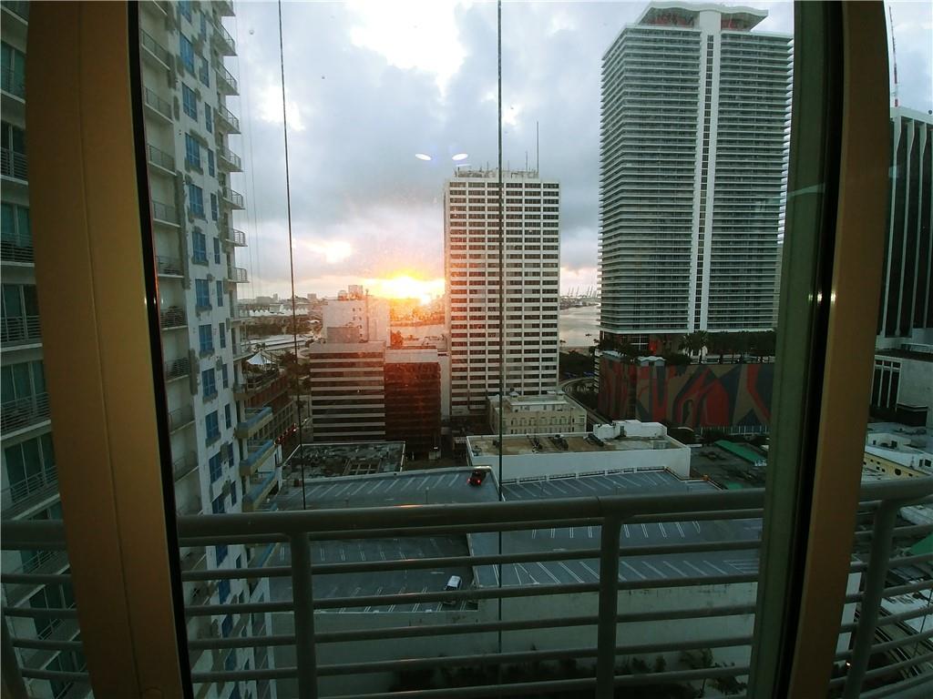 LIVING 18 STORIES ABOVE THE PULSE OF DOWNTOWN MIAMI HAS ITS PERKS. JUST STEPS TO ENDLESS SHOPPING, ENTERTAINMENT, HOTELS AND A MULTITUDE OF DINING OPTIONS. THIS GORGEOUS ENCLOSED 2 BD/2 BTH LOFT HAS 10 FOOT CEILINGS WITH VIEWS OF BEAUTIFUL MIAMI SKYLINE AND BISCAYNE BAY. THE MODERN AND CHIC LOFT II HIGH RISE, OFFERS; 24 HOUR SECURITY LOBBY; PARKING; A HEATED ROOFTOP POOL; HOT TUB; SAUNA; JACUZZI AND FULLY EQUIPPED BAY VIEW GYM ALSO ON THE ROOF. THE SPACIOUS RECREATION ROOM HAS A POOL TABLE AND YOGA ROOM. LIVE WALKING DISTANCE OF BAYSIDE MARKET PLACE, AMERICAN AIRLINES ARENA, THE METRO MOVER AND MIAMI DADE COMMUNITY COLLEGE. TENANT PAYS $60 PER MONTH FOR PARKING- Can not be shown before 7/21-see virtual tour in listing